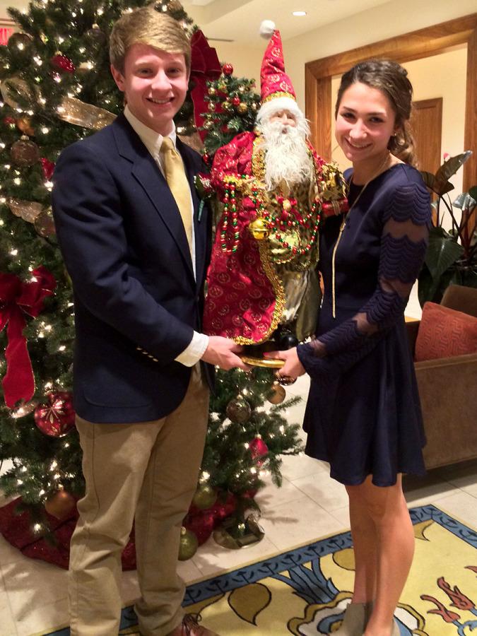 Rockhurst senior Noah Reis and senior Meghan Kearney take the typical pre-dance picture with Santa.
