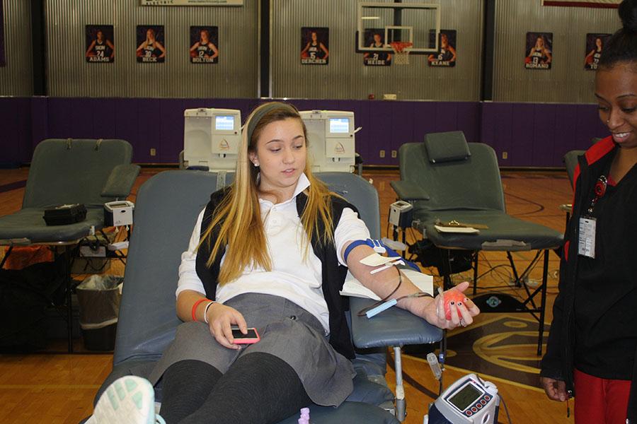 Sophomore Lizzie O'Connell successfully donates blood to Community Blood Center. According to the American Red Cross, the pint of blood that she donated can save three lives.