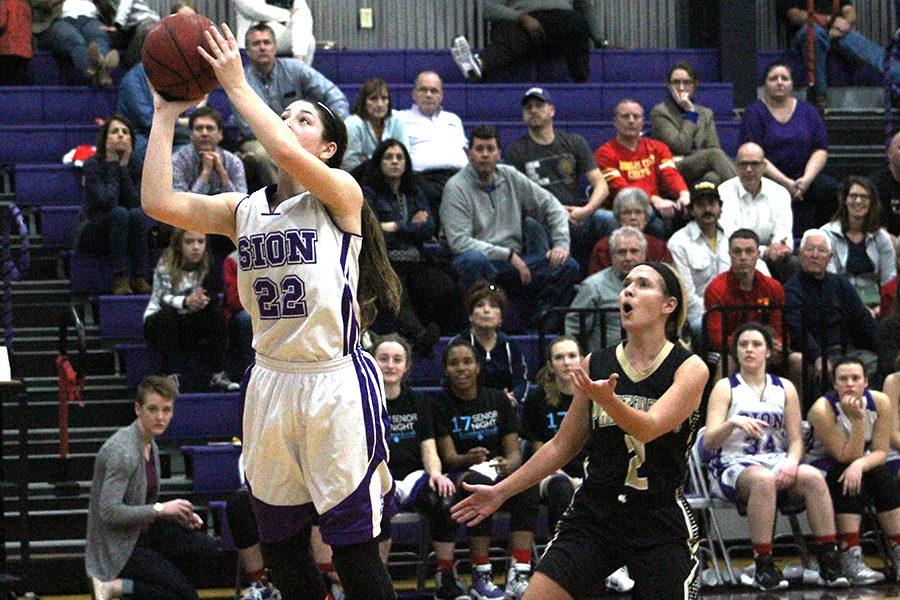 Junior Sarah Totta goes up to take a shot during the last quarter of the game.
