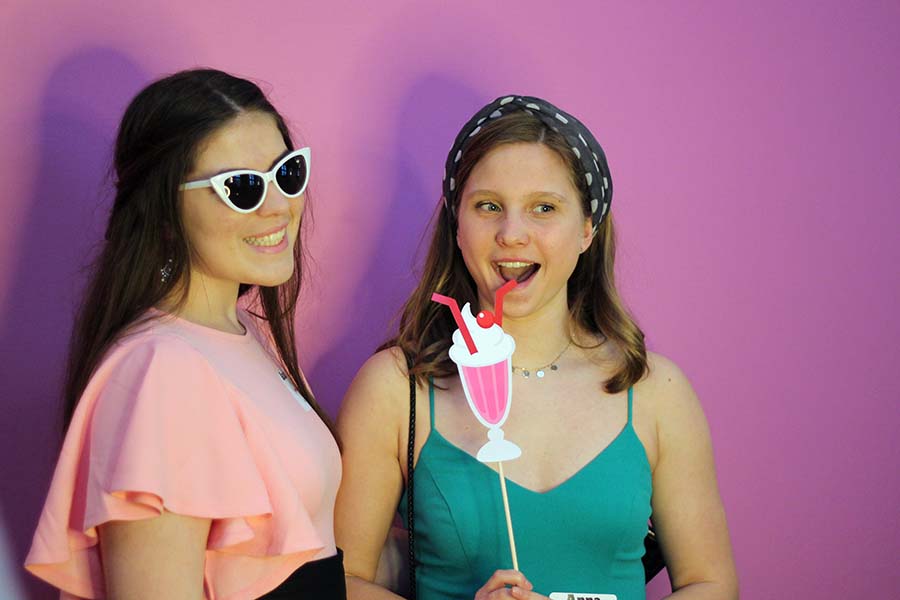 Sophomores Audrey Wohletz and Anna Baklanov pose for the photo booth picture during the annual Father Daughter dance on Feb. 9.