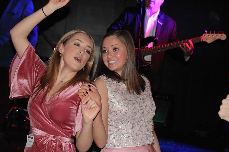 Seniors Bridget Schumm and Peyton Wiewel dance together during the annual Father-Daughter dance Saturday, Feb. 9 at the Sheraton in Overland Park, KS. This years theme was Pink Ladies.