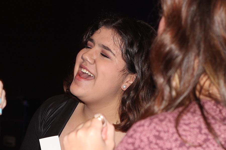 Senior Maya Bair sings along to a song during the annual Father Daughter dance on Feb. 9.