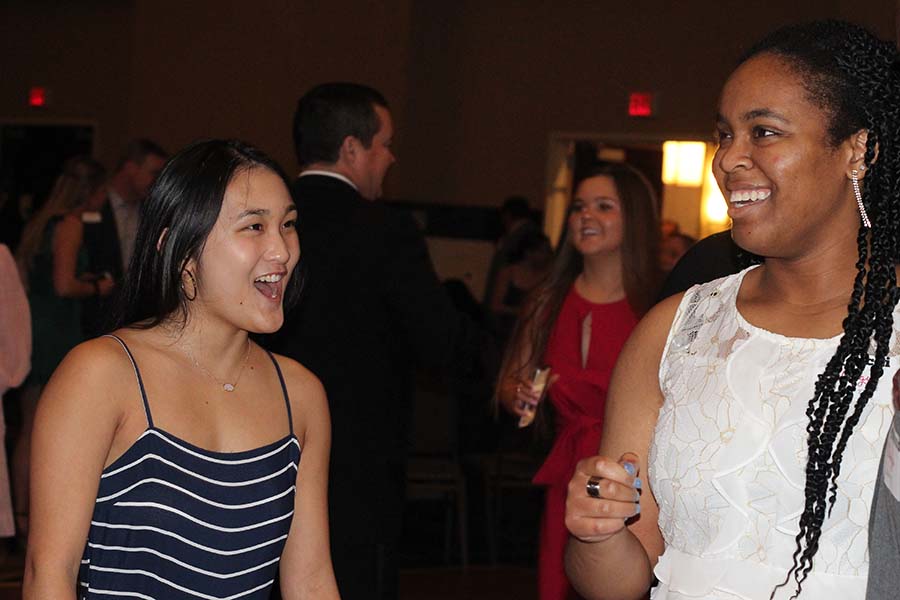 Seniors Caroline Ehren and Munachi Okuagu dance after dinner during the annual Father-Daughter dance Feb. 9. 