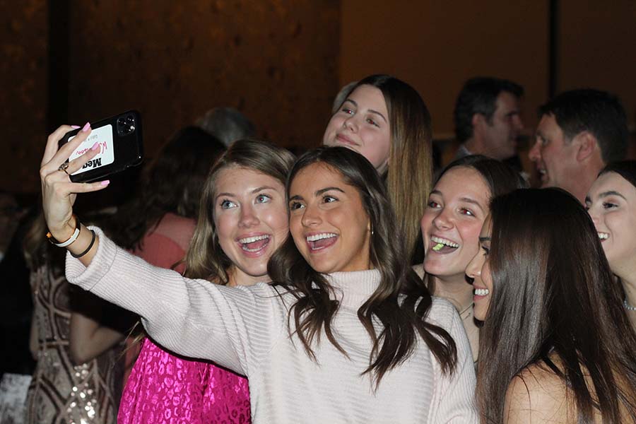 Seniors Dana Kalt, Anna Breckinridge, Caroline Boessen, Brooke McKee, Stephanie Vince and Meg Wilkerson pose for a selfie during the annual Father Daughter dance Feb. 9 at the Sheraton in Overland Park, KS. This years theme was Pink Ladies.
