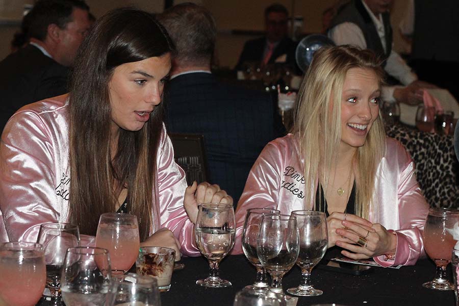 Seniors Olivia Townsend and Reilly Jackoboice laugh at a joke during the annual Father Daughter dance on Feb. 9.