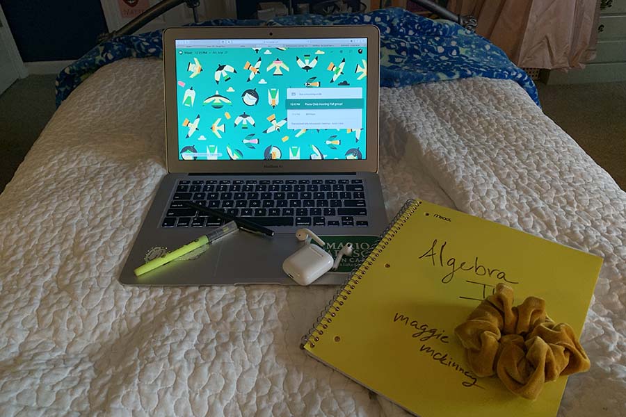 Report Maggie McKinney's virtual learning workspace was situated on her bed throughout the first week. McKinney always kept her laptop, her AirPods, a scrunchie, writing utensils and her notebooks close by so she wouldn't have to get up during class. 