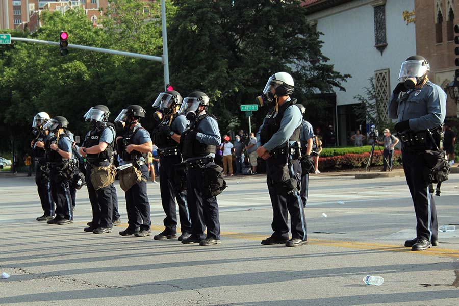 A line of Kansas City Police officers stand in a line near the Black Lives Matter protest at the Country Club Plaza on May 30. 