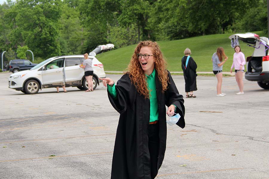 Director of Athletics Kate Pilgreen chats with other teachers while getting ready for the graduation parade in the parking lot on May 21.