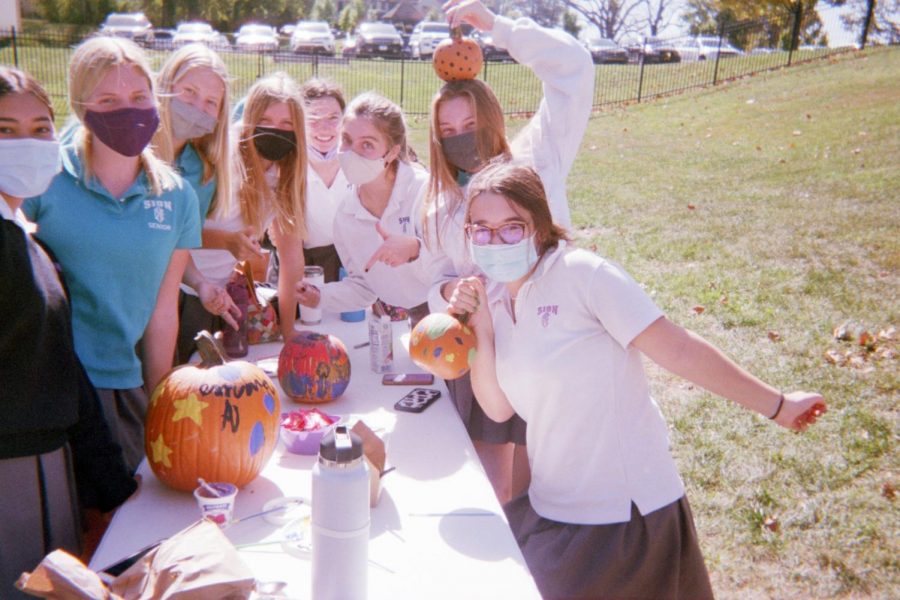 Seniors decorate pumpkins a few weeks after the senior retreat. 