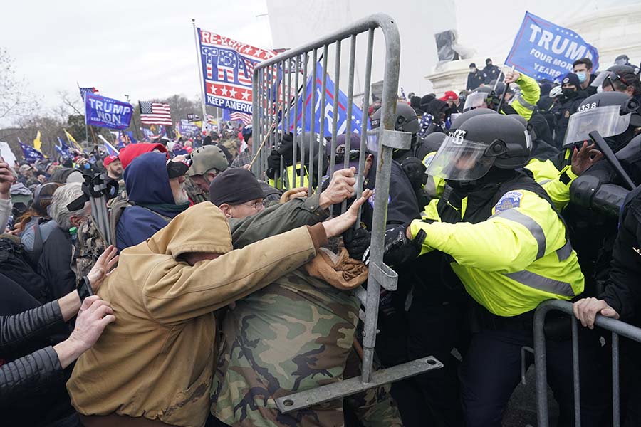 Protesters gather on the second day of pro-Trump events fueled by President Donald Trumps continued claims of election fraud in an effort to overturn the results before Congress finalizes them in a joint session of the 117th Congress on Wednesday, Jan. 6, 2021, in Washington, D.C. (Kent Nishimura/Los Angeles Times/TNS)