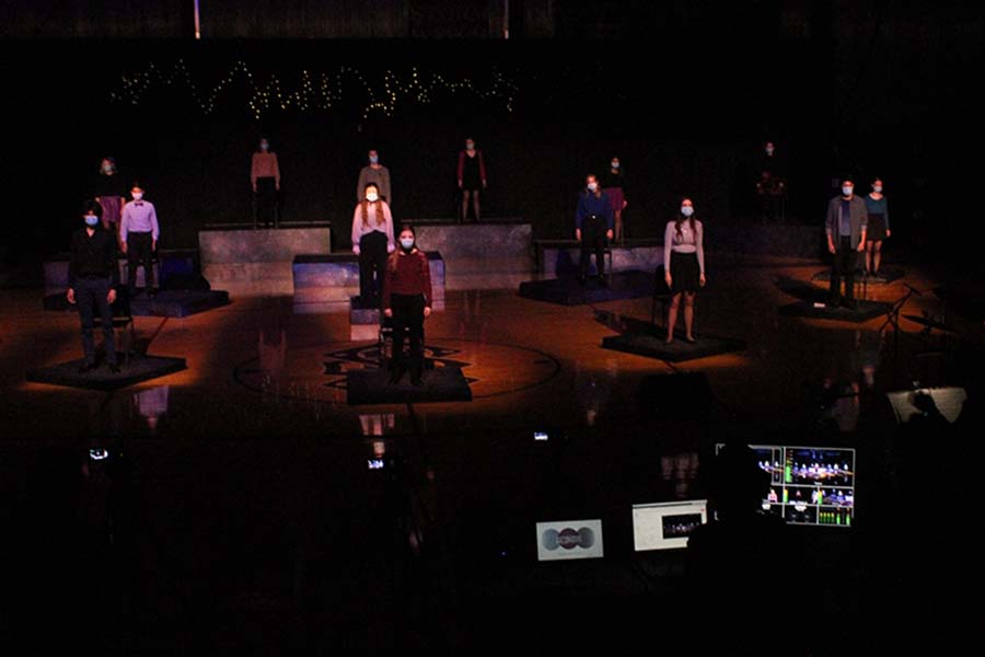 The entire musical cast performs the opening song while the tech crew manages the live streaming. 