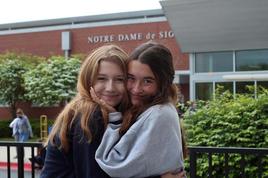 Web Editor-in-Chief Maggie McKinney and Social Media Coordinator embrace during College Decision Day on May. 6.