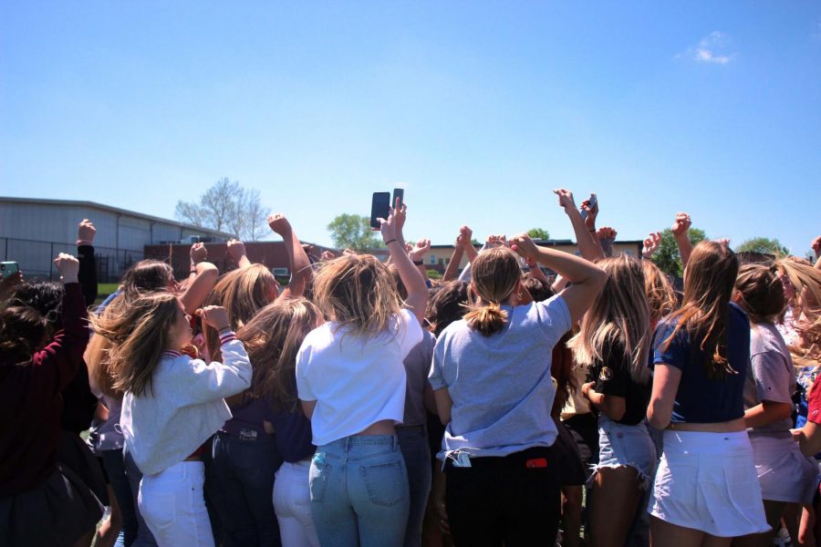 All the 2021 seniors jump chanting seniors rock the house one last time in the courtyard on May 6..