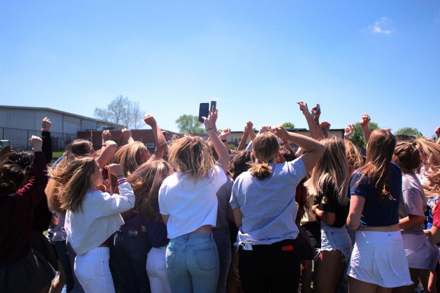 All the 2021 seniors jump chanting "seniors rock the house" one last time in the courtyard on May 6..