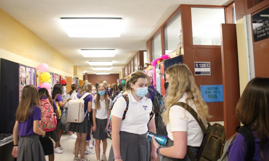 The freshman hallway was teeming with students going from class to class. Noting what she likes about being a freshman as Sion, freshman Gretchen Kowalewich said, "I like it here. Everyone is really talkative and nice."