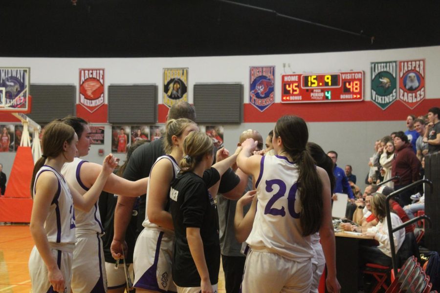 The team rallies together for the final stretch of the game. 