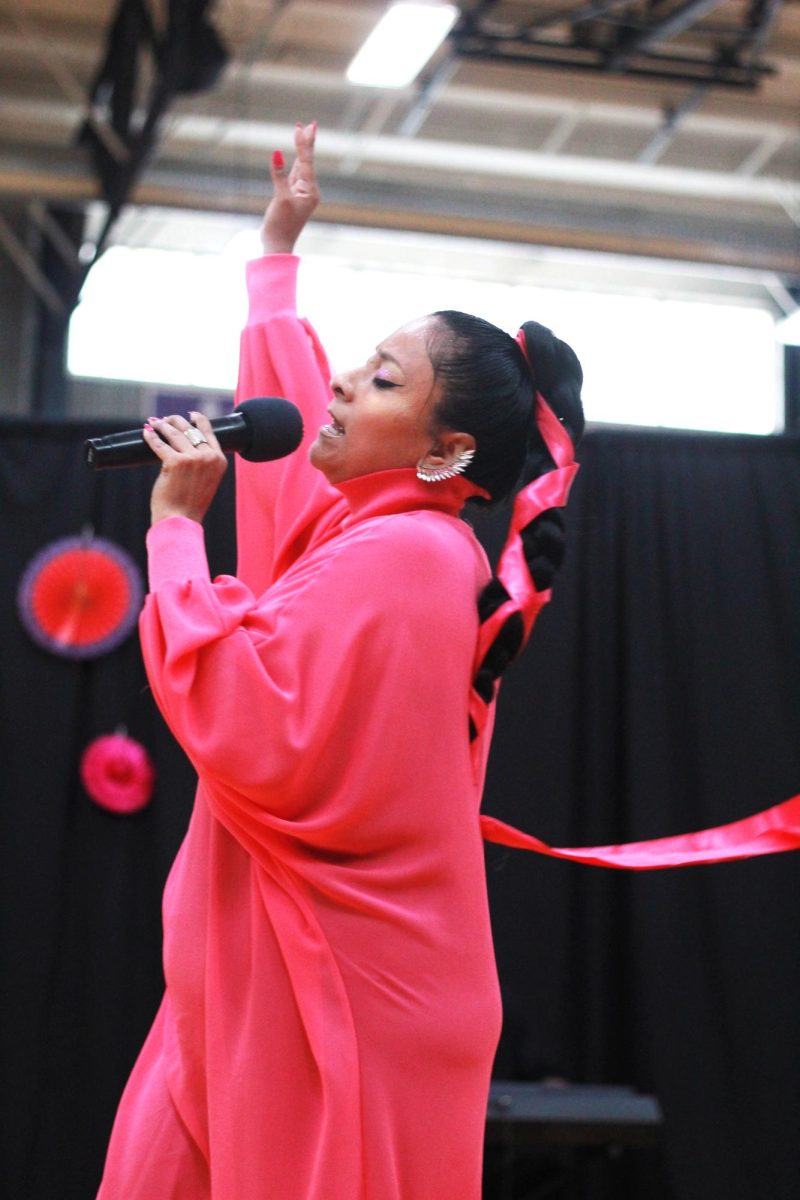 Singer Jessica Ayala dances across the gym floor as she shares her story through song. In addition to being a singer and dancer, Ayala is also a published author.