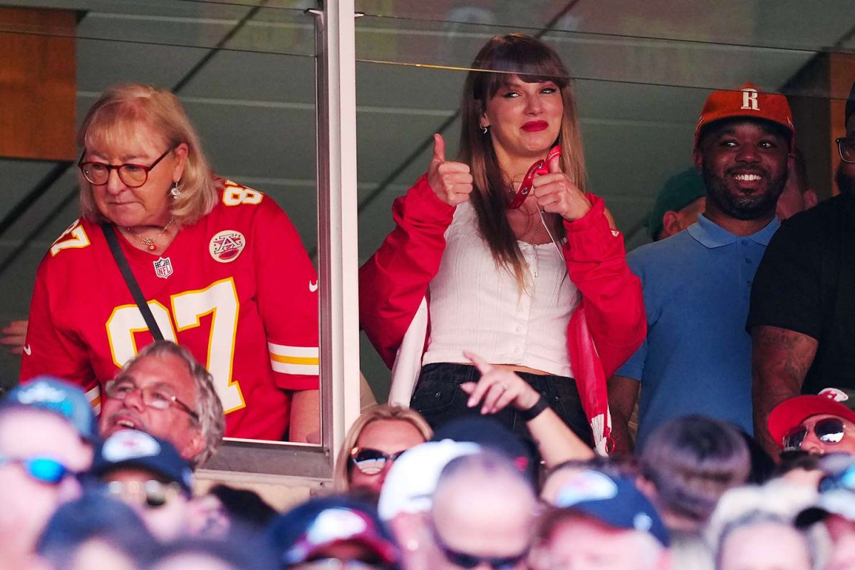 Taylor Swift cheers on Travis Kelce next to his mother Donna Kelce, in his suite box.