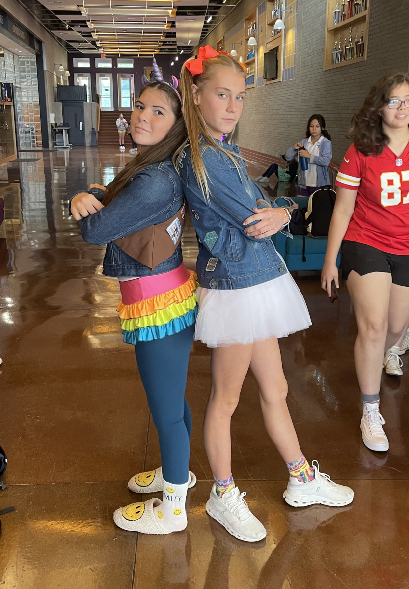 Freshmen Cecille Kowalewich and Maddie Westmeyer stand back to back on Dress As Your Kindergarten Self Day October 4. 