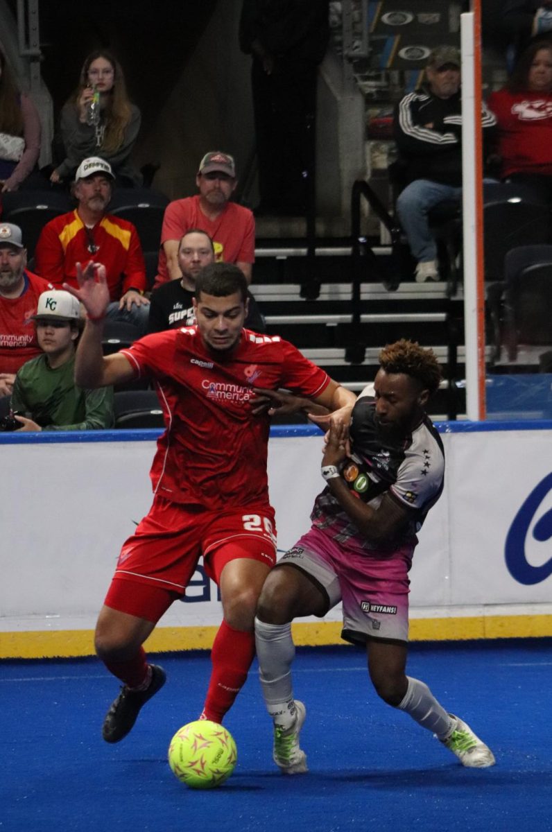Comets forward Rian Marques protects the ball from Strykers defender.