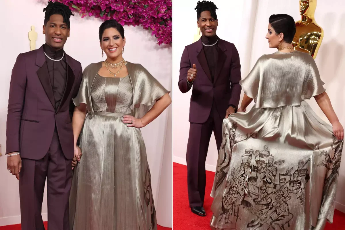 The back of Suleika Jaouad Batistes dress depicts Jon Batiste conducting a symphony. 