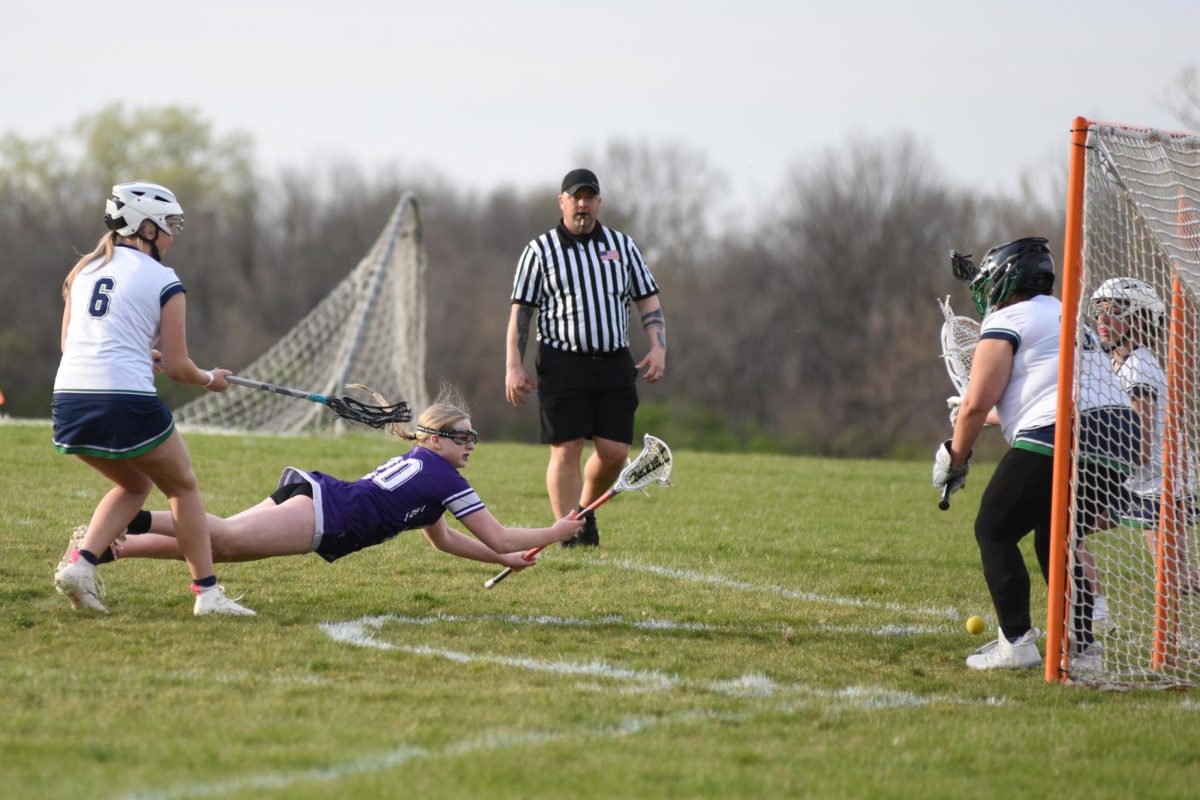 Flying towards the goal, junior Sophie Falk shoots, despite the odd angle, during the Sion v. St. Michael the Archangel game. 

Photo submitted by Rodney Miller 