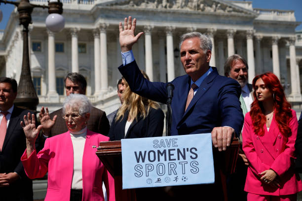 WASHINGTON, DC - APRIL 20: Speaker of the House Kevin McCarthy (R-CA) (C) and Rep. Virginia Foxx (R-VA) (L) raise their hands when asked if they know a transgender woman during an event to celebrate the House passing The Protection Of Women And Girls In Sports Act outside the U.S. Capitol on April 20, 2023 in Washington, DC. President Joe Biden has promised to veto the legislation, which defines sex as based solely on a person’s reproductive biology and genetics at birth and would ban all transgender women and girls from competing in female school sports. (Photo by Chip Somodevilla/Getty Images)